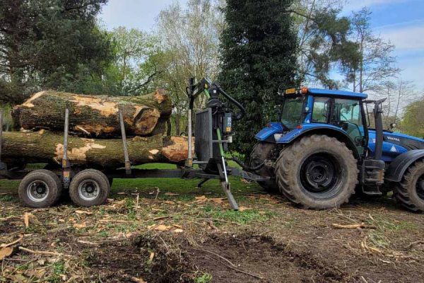 Dobells Professional Tree Care & Arboricultural Contractors | Crane Assisted Tree Work | Tractor with trailer