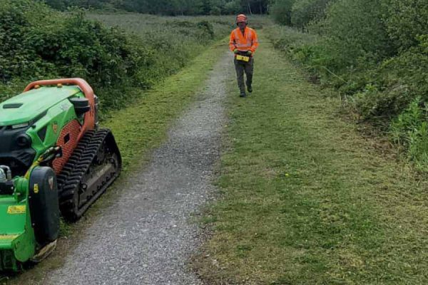 Dobells Professional Tree Care & Arboricultural Contractors | ARB Specific Plant Hire | Worker walking along path